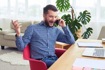 Wall Mural - Dark-haired man talking on telephone