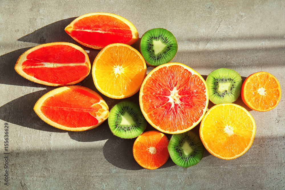 Beautiful composition with fresh fruits on gray background
