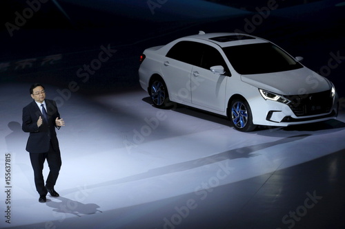 Byd Co Ltd Chairman And President Chuanfu Speaks Next To Its Byd Co Ltd Chairman And President Chuanfu Speaks Next To Its Hybrid Electric Car