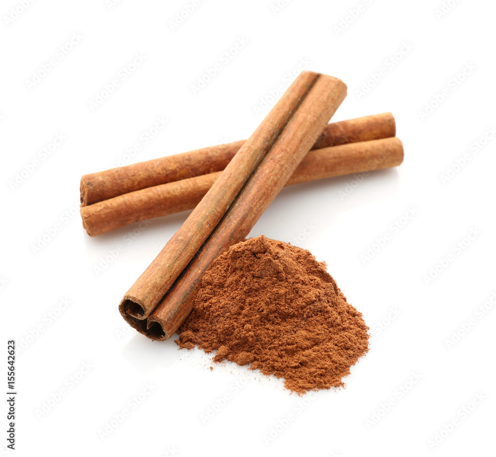 Cinnamon sticks and powder isolated on white, closeup