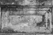 Damaged, old and plaster peeled off of a wall in black&white.