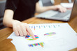 © nattanan - Business woman use computer laptop pointing to financial report at conference room. copy space. business people and technology concept.
