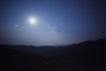 Wall Mural - night nature background, cloudy sky with stars and moon light