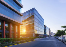 Street In Budapest With Modern Office Buildings, Sun Reflections On Glass Windows