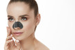 Beautiful Woman With Beauty Face And Skin Care Patch On Nose