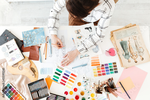 Top view cropped photo of young woman fashion illustrator drawing Tableau sur Toile