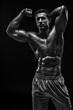 © nazarovsergey - Muscular and fit young bodybuilder fitness male model posing ove
