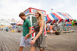 Teenage couple at boardwalk fun fair