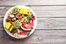 Fresh Fruit Salad On A Grey Wooden Table