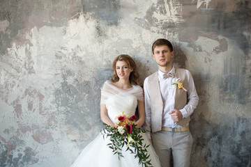 Portrait of a wedding couple in a loft room