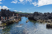 People Swimming And Enjoying Summer In Natural Lava Swimming Pools, Terceira, Azores, Portugal