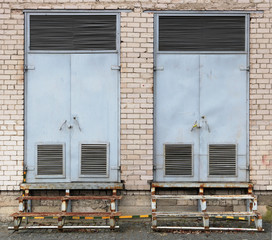 Two gray vintage  metal gates