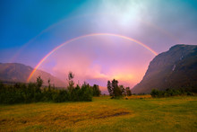 Beautiful Rainbow Over The Mountains During Sunset. Wilderness Norway