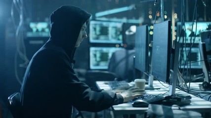 Aufkleber - Hooded Hacker Breaks into Corporate Data Servers from His Underground Hideout. Place Has Dark Atmosphere, Multiple Displays, Cables Everywhere. Shot on RED EPIC-W 8K Helium Cinema Camera.