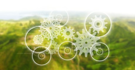 Wall Mural - white gear graphics against green blurry mountains