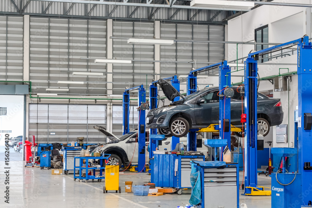 Bangkok Thailand, December 10, 2016: Car in the lifting equipment in the garage being repair and fix at Bangkok,Thailand