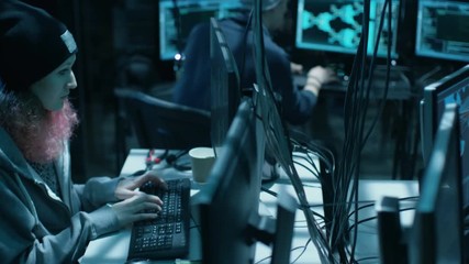 Aufkleber - Back View of Teenage Hacker Infecting with Virus Data Servers of Government Infrastructure. His Hideout is Dark with Many Monitors Around. Shot on RED EPIC-W 8K Helium Cinema Camera.