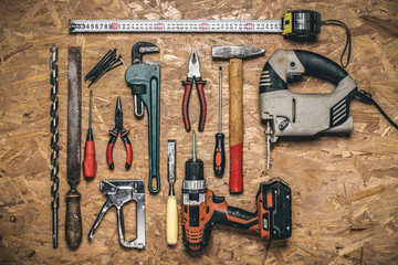 A set of hand tools for working on wood on the panel of OSB