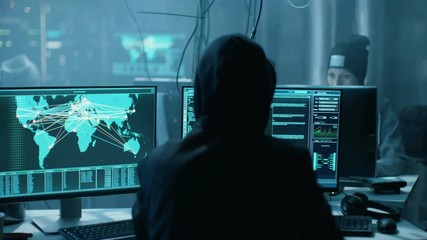Aufkleber - Team of Internationally Wanted Hackers Teem Organize Advanced Virus Attack on Corporate Servers. Place is Dark and Has Multiple displays.Shot on RED EPIC-W 8K Helium Cinema Camera.