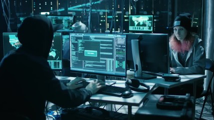 Aufkleber - Team of Internationally Wanted Hackers Teem Organize Advanced Malware Attack on Corporate Servers. Place is Dark and Has Multiple displays. Shot on RED EPIC-W 8K Helium Cinema Camera.
