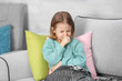 © Africa Studio - Small ill girl on couch at home