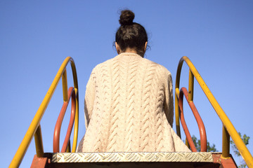 Rear view of a young woman.