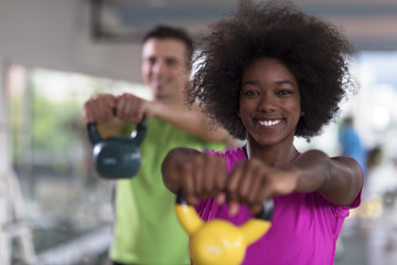 couple  workout with weights at  crossfit gym