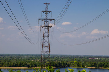 High voltage power line against blue sky