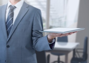 Poster - Businessman holding tablet in office