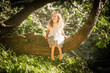 outdoor portrait of young child girl in magic forest, outdoor natural background