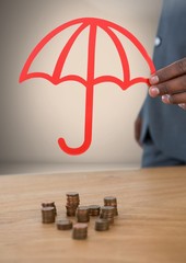 Wall Mural - Cut out umbrella protecting money coins