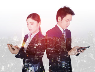 double exposure of business man and woman using smartphone with city background