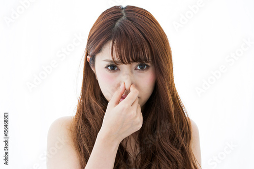 鼻をつまむ女性 Stock Photo Adobe Stock
