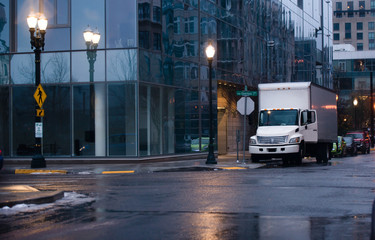 Wall Mural - Semi truck with box trailer in night rainy city street