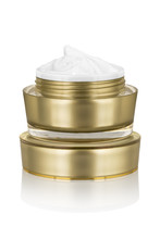 Luxury Cosmetic Face Moisturizing Smudged White Cream For Aged Skin In Open Glossy Golden Can Sitting On Matching Lid, Isolated On White Background, Clipping Path Included