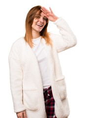 Canvas Print - Young woman in dressing gown saluting