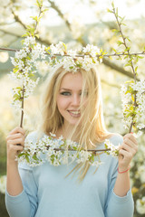 Sticker - Happy girl smiling in frame of white, blossoming flowers