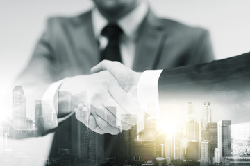 Poster - two businessmen shaking hands at office