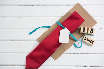 Wall Mural - Overhead view of necktie with calendar date