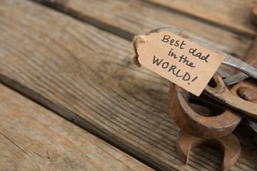 Wall Mural - High angle view of greetings on rusty work tools