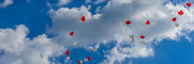 Heart Balloons Flying Into The Sky At A Wedding