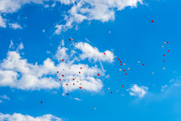 Wall Mural - Heart balloons flying into the sky at a wedding