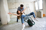 Fototapeta  - Loving couple is having fun while they are renovating house