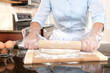 Woman Rolling Dough