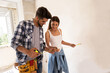 Lovely couple with tape measure, renovation concept