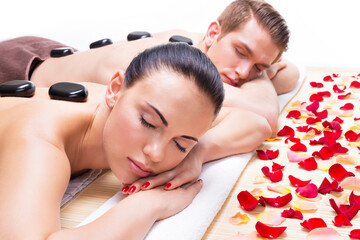 Poster - Attractive couple relaxing in spa salon.