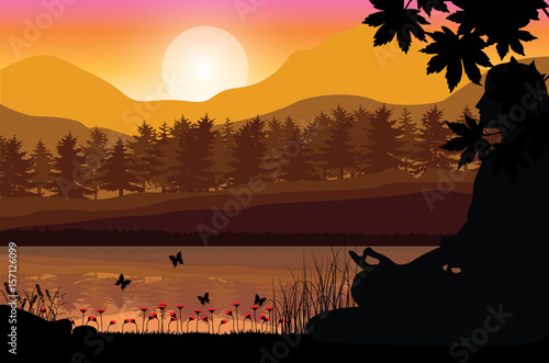 Fototapeta Man meditating in sitting yoga position on the top of a mountains above clouds at sunset