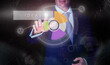 © Duncan Andison - A businessman selecting a Ideas button on a computerised display screen.
