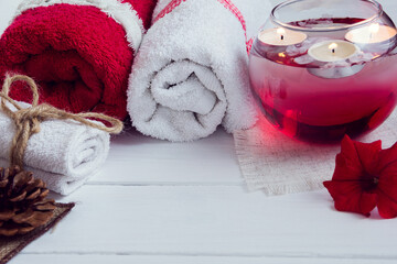 SPA consist from towels, candles, flowers, and aromatherapy water 