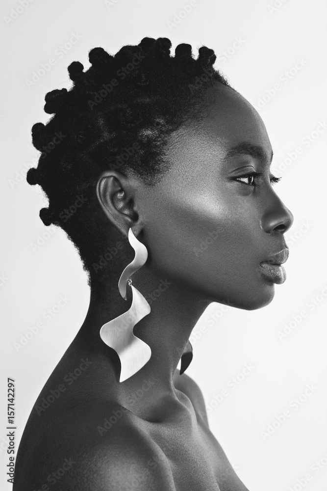 Beautiful black girl with big earrings Stock Photo | Adobe Stock